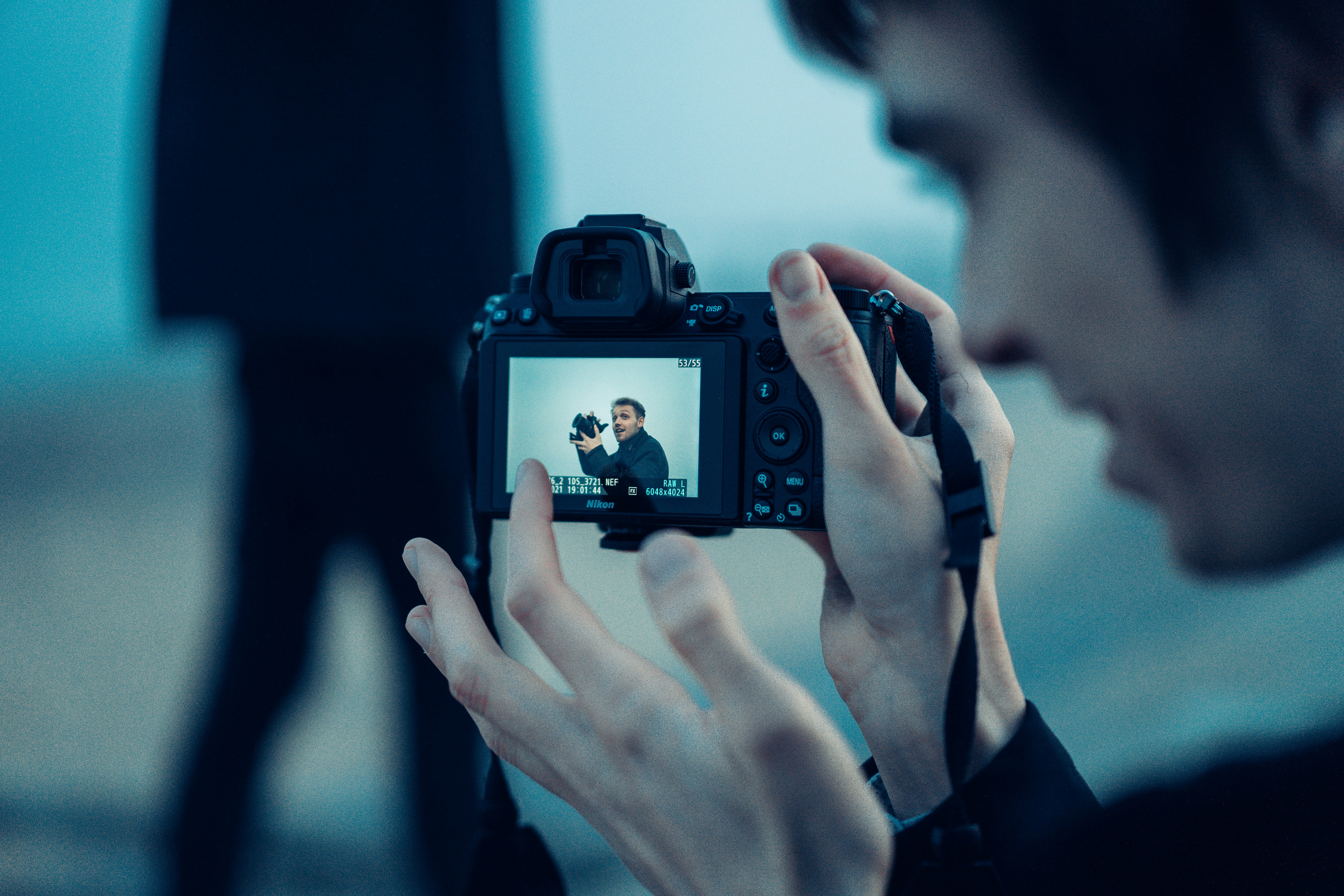 person holding black dslr camera